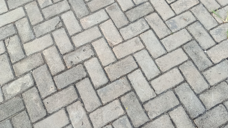 Sand jointed interlocking patio pavers