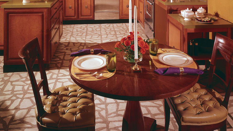 1970s era wood furniture in the carpeted kitchen.