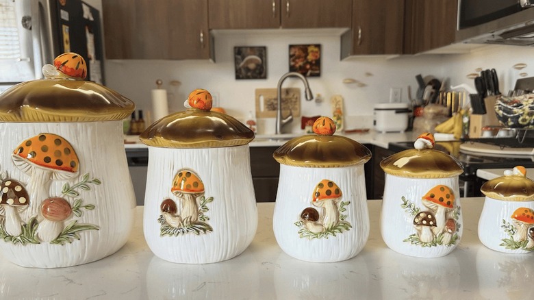 Vintage Sears Merry Mushroom canisters on a counter
