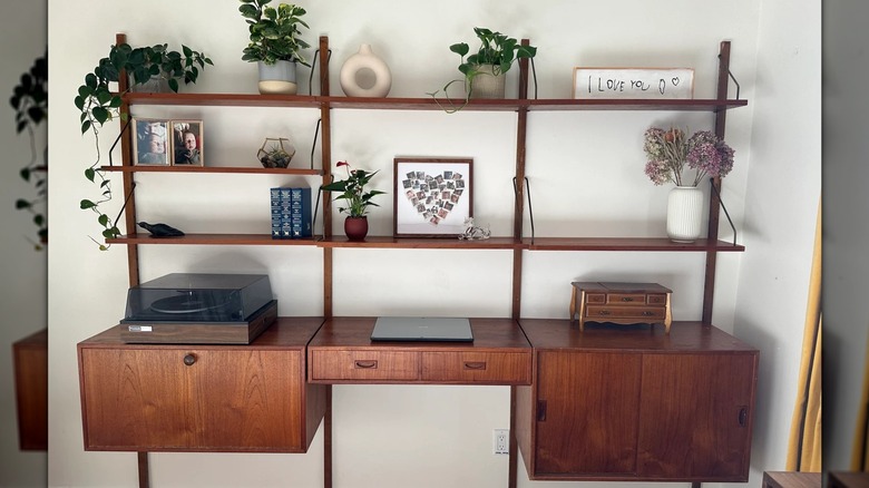 A modular mid-century teak wall unit.