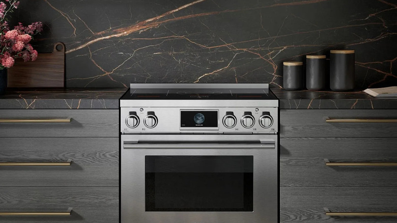 modern dark kitchen with stainless steel SKS range