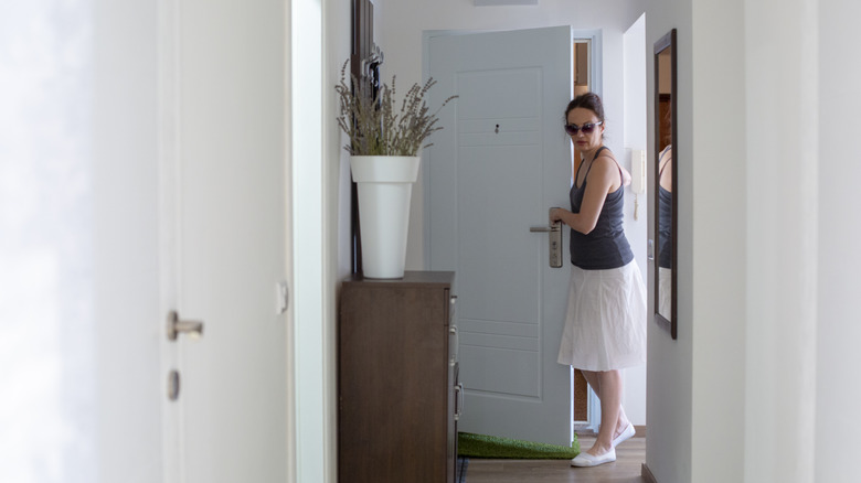 Person walking through the front door