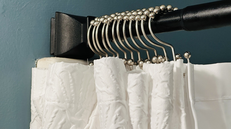 Shower curtain hooks on rod