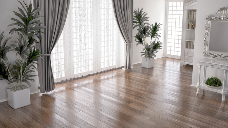 A bedroom with hardwood flooring
