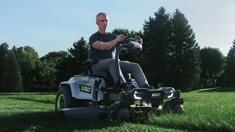 A man riding an EGO ZT4205S lawn mower.