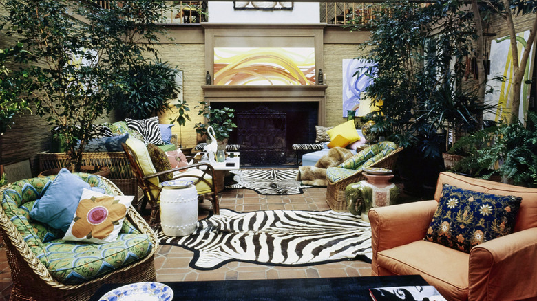 '70s style living room with colorful and patterned furniture and decor