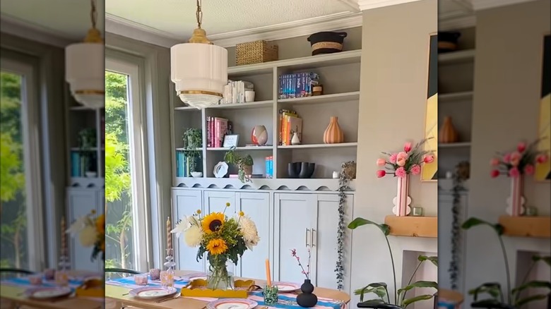 IKEA BILLY bookcases on top of HAVSTA cabinets to create built-ins on either side of the fireplace