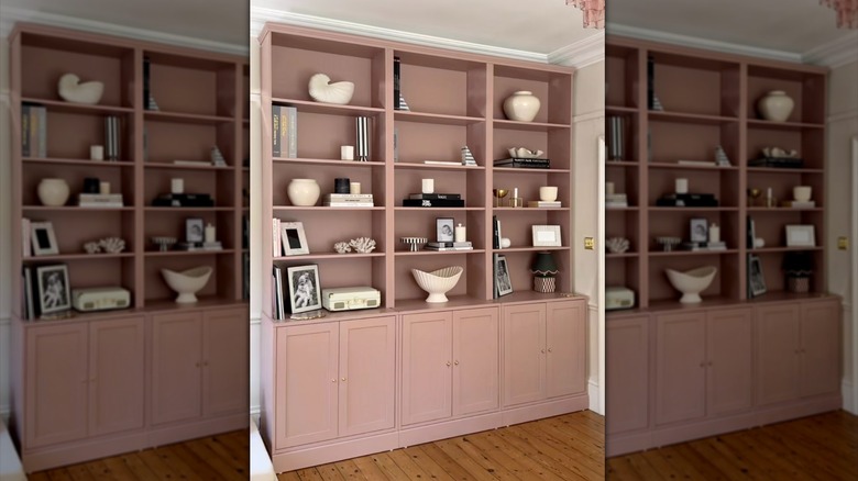 painted pink IKEA BILLY bookshelves over HAVSTA cabinets to create living room built-ins