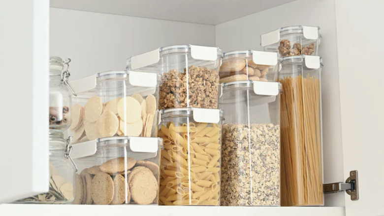 Plastic food organizers from MUJI in a cabinet