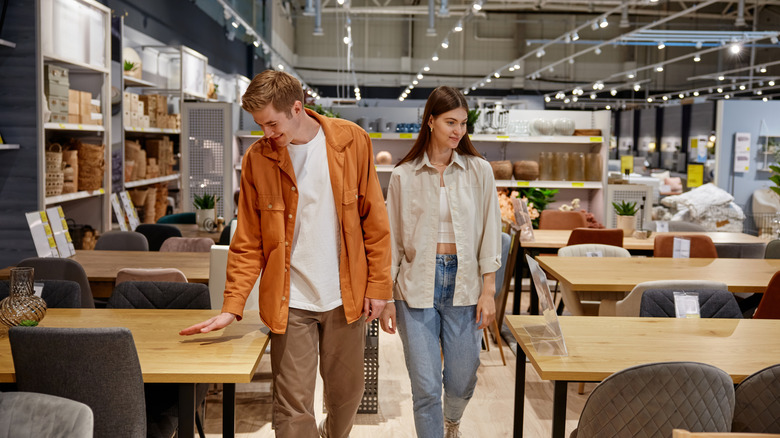 Couple shopping together at a furniture store