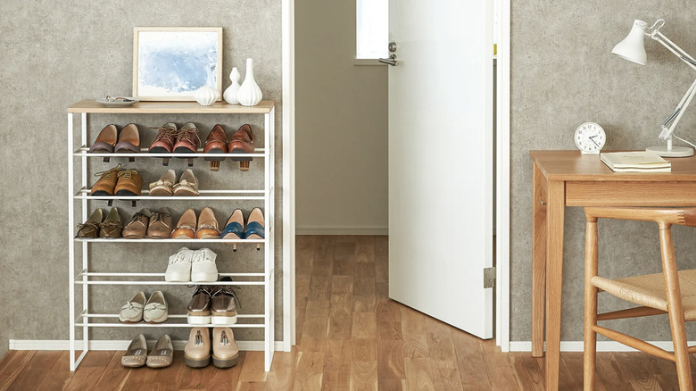Tiered shoe rack in a minimalist entryway