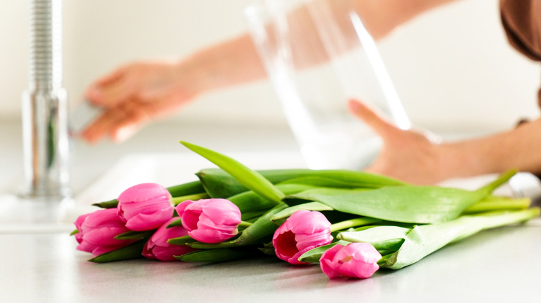 woman filling vase