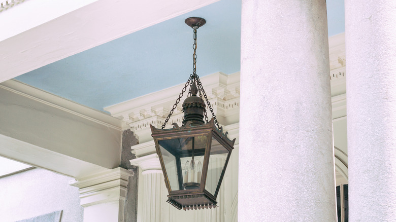Haint blue porch ceiling with light fixture