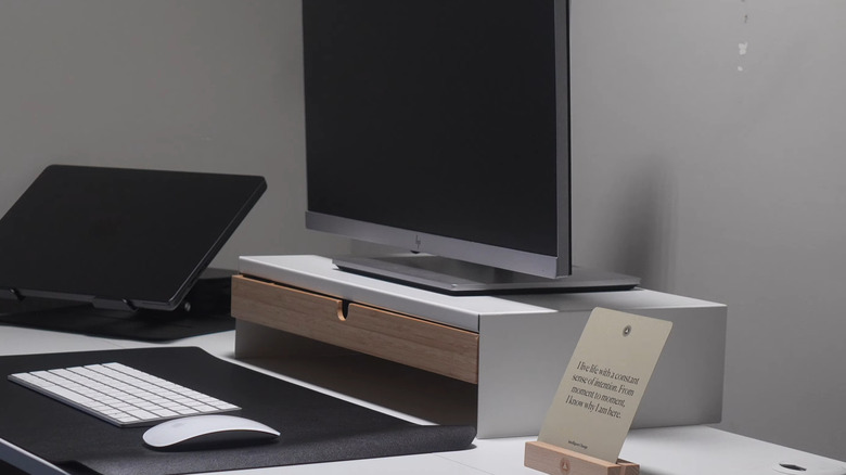 A monitor sitting on an IKEA ELLOVEN stand