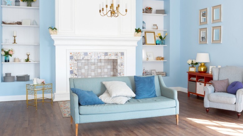 living room with light blue walls and traditional elements