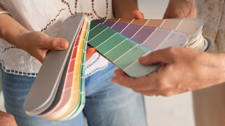 People looking at paint samples