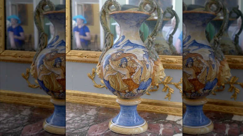 An Italian faience vase with an elaborate painting on it