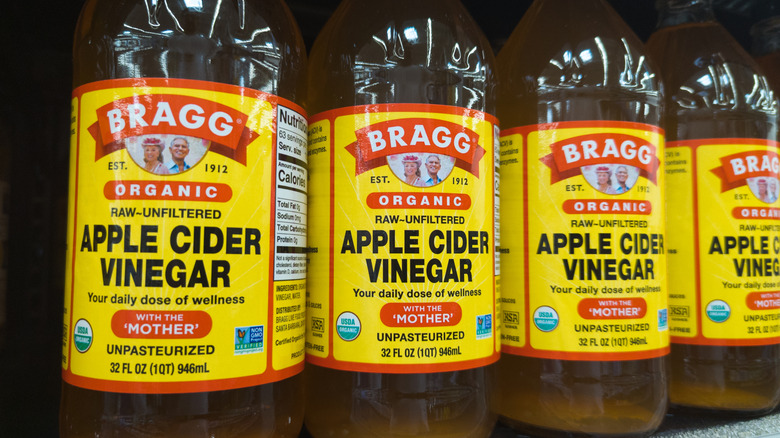 Bottles of apple cider viengar on a store shelf