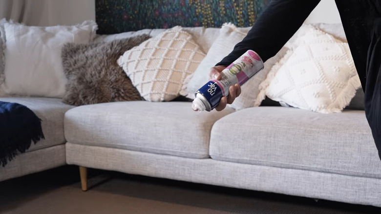 Woman preparing to spray a can of no vac