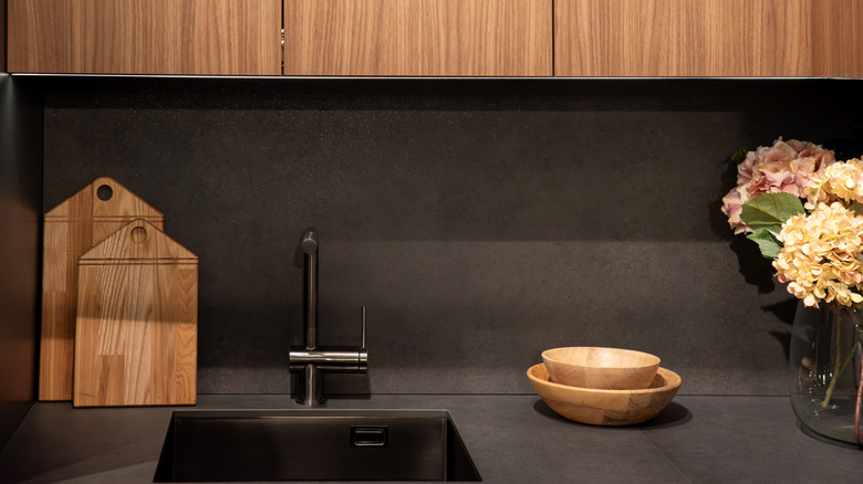 Sink set into matte black countertop