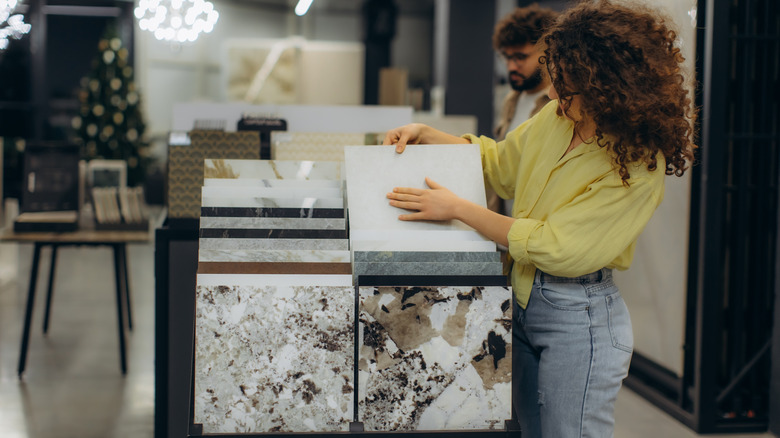 Woman looking at stone samples
