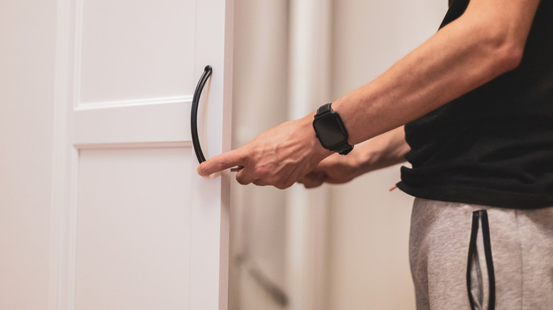 installing handles on a white wardrobe door