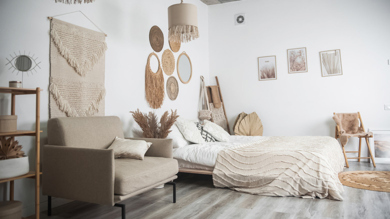 bohemian bedroom with taupe chair
