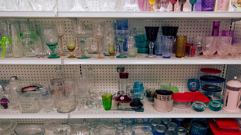 thrift store shelves filled with glassware
