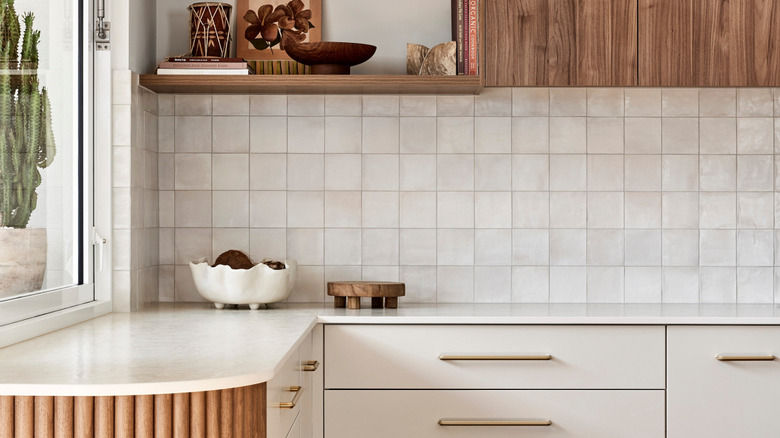 Scandanavian style kitchen with warm white zellige tile backsplash