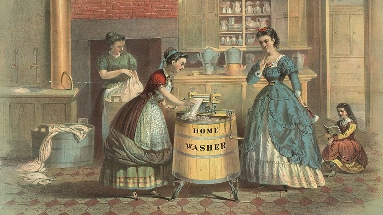 A color illustration depicts four women using a home washer with a wooden tub and hand crank during the 1800s.