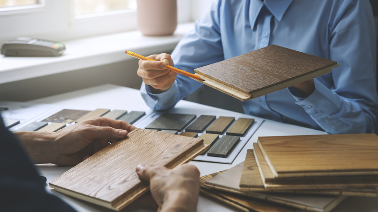 two people looking at flooring samples
