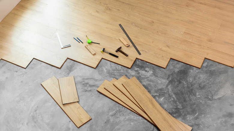 Wooden flooring planks, with measuring tools on the side