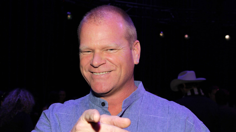 Mike Holmes smiling and pointing at camera