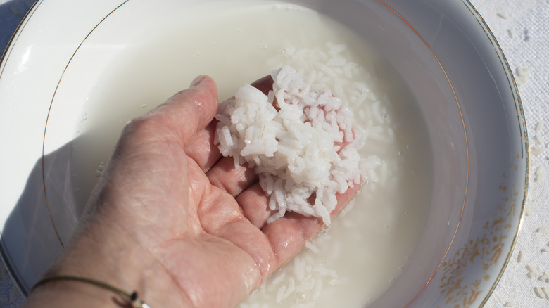 Hand washing rice in water