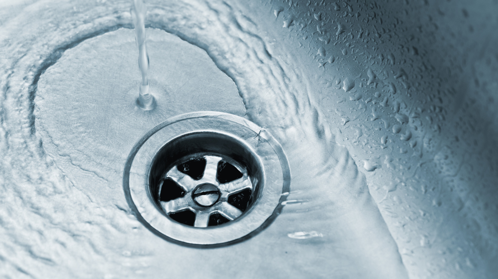 The Genius Aluminum Foil Hack That Protects Drains From Grease Damage