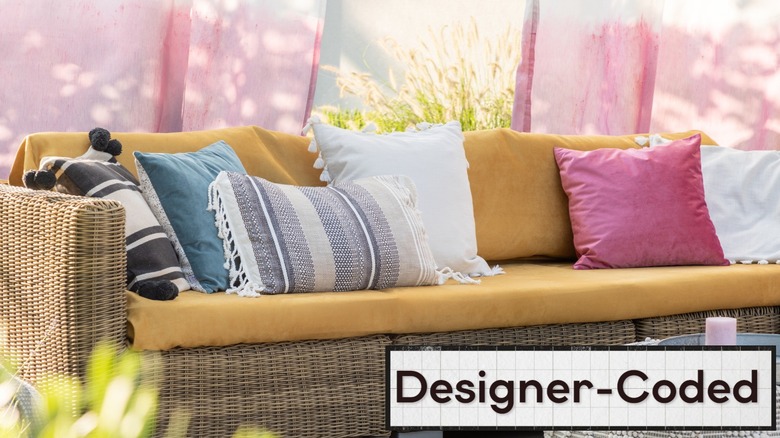 Outdoor patio sofa with an assortment of outdoor pillows