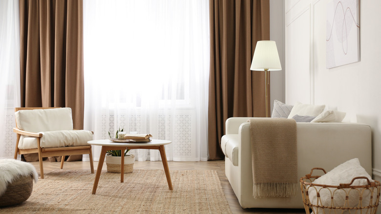 living room with brown velvet drapes