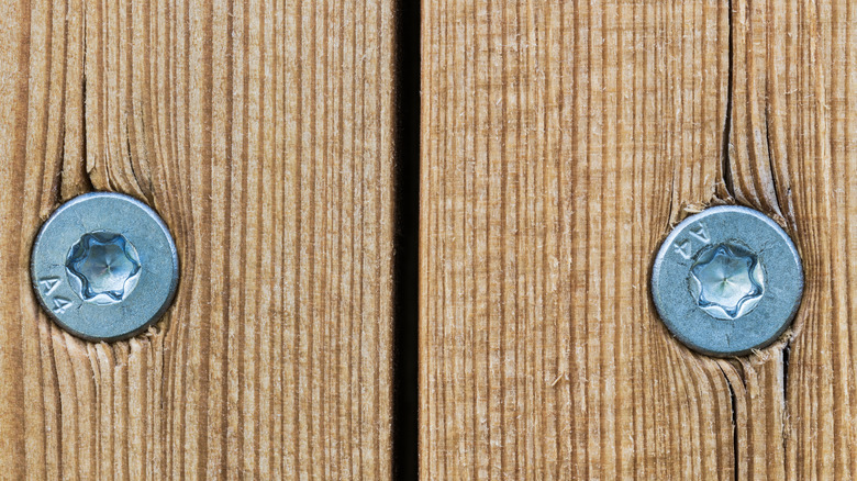 Close-up of screws driven into Douglass Fir