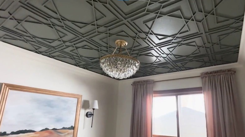 green fretwork panels on a ceiling