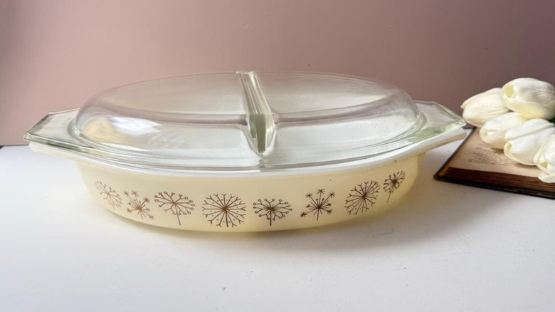 Stack of cream and pink vintage Pyrex dishes