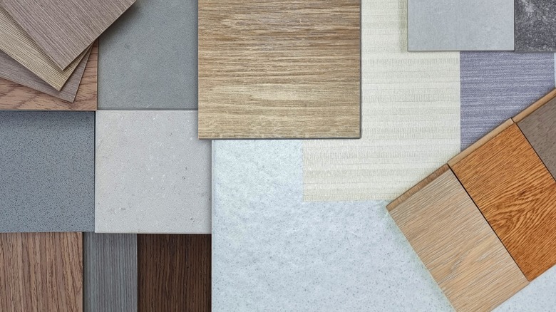 flooring samples of wood, tile, and laminate arranged for selection