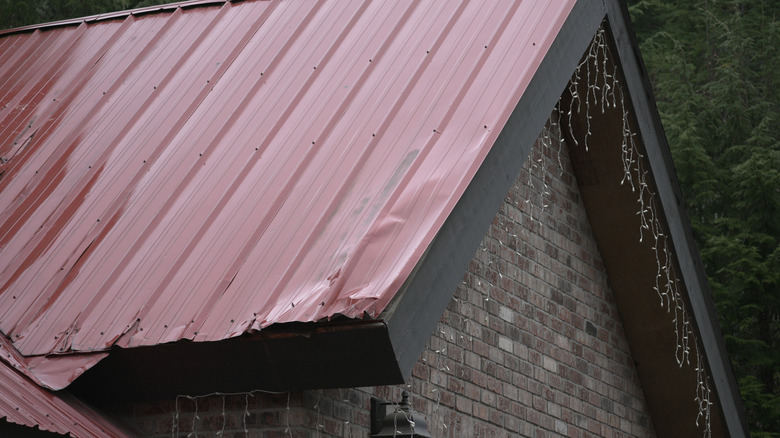 close up of damaged metal roofing