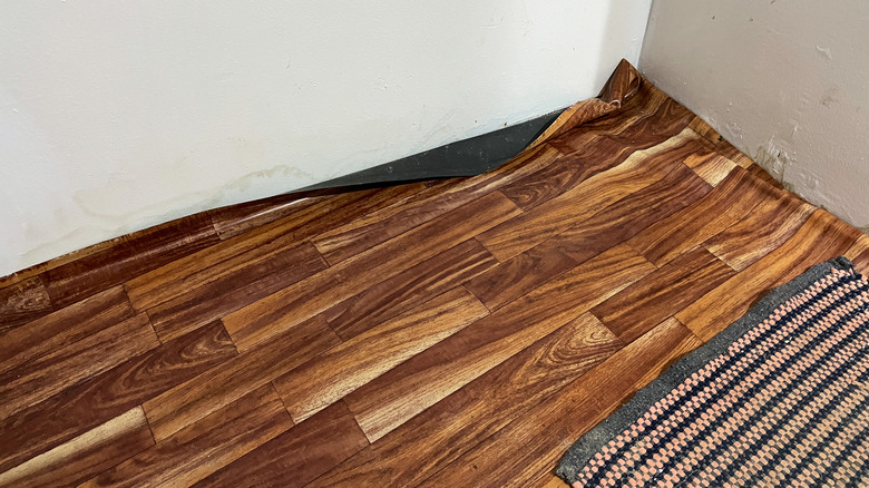 Vinyl sheet flooring patterned like wood boards