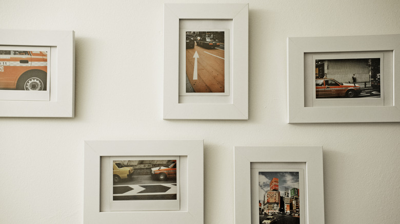 Polaroid photos framed on a wall