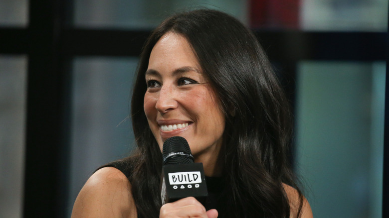 close up of Joanna Gaines holding microphone