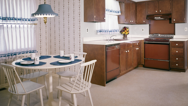 a vintage kitchen showroom model with wall-to-wall carpet