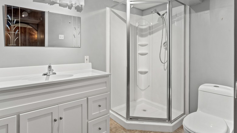 Bathroom with a white shower pod in the corner