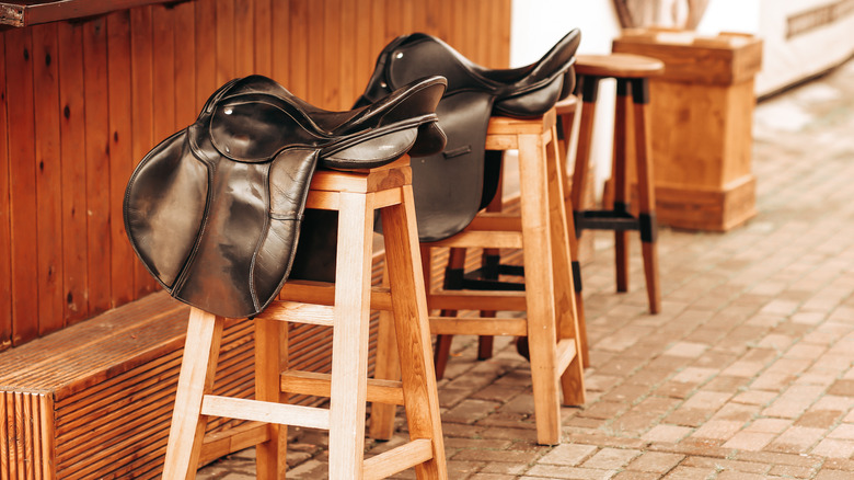 Bar stools decorated with horse saddles