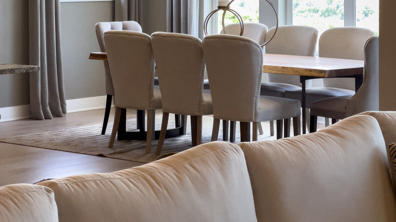 dining room table against a bunch of windows