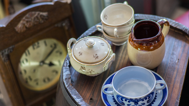 old mugs and dishes at estate sale or antique store